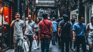 Chinese men and women walking in the street