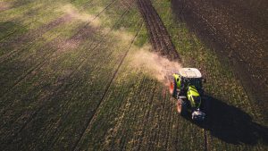 A tractor working in crops
