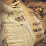 Image depicting global grain and coffee sacks for export