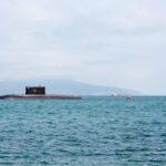 Photo of a submarine emerging out of the water