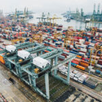 A photo of shipping containers in a port yard