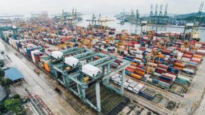 A photo of shipping containers in a port yard