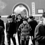 Photo of Chinese men and women in a town square