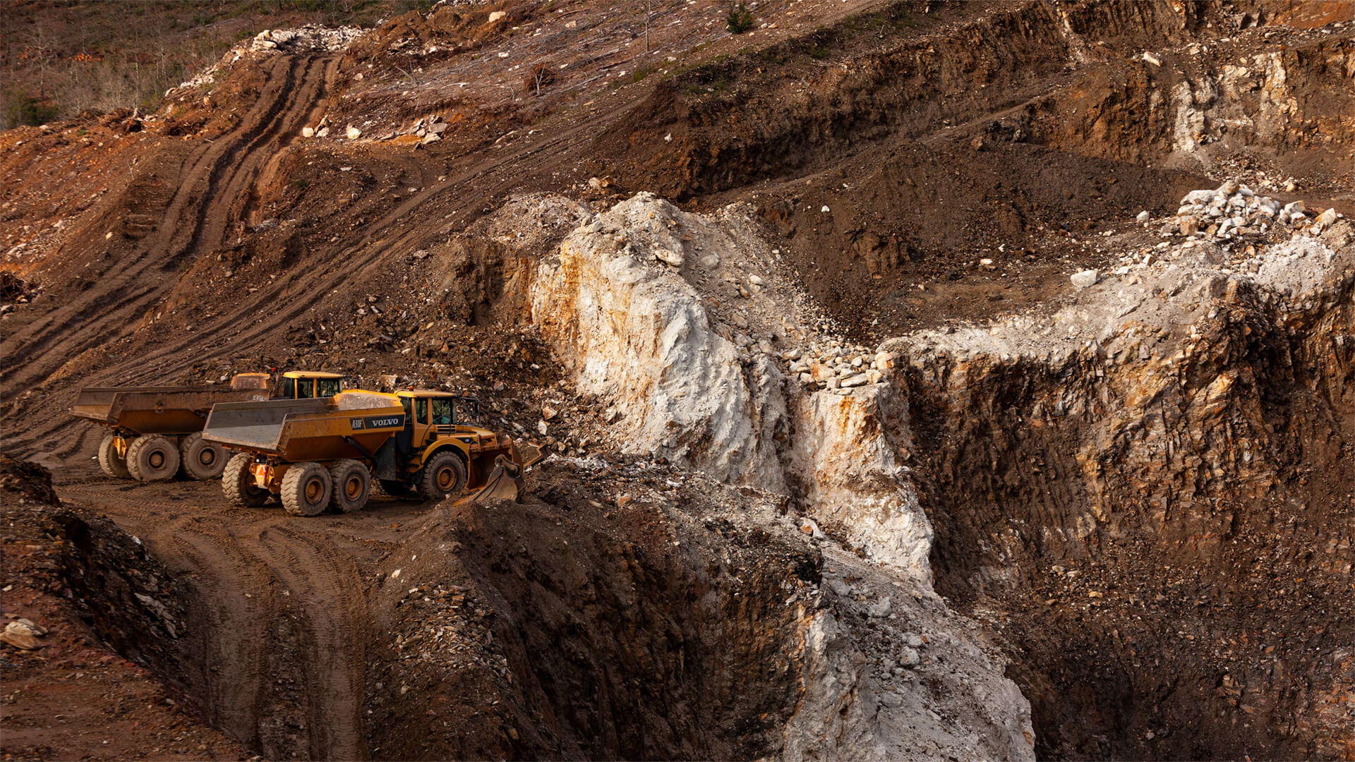 Photo showing trucks at a lithium mine