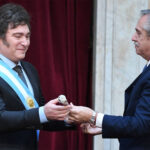 Alberto Fernández awarding Milei the presidential scepter during the inauguration on 10 December 2023