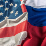 Flags of USA and Russia merging