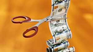 Photo of $100 bill being cut