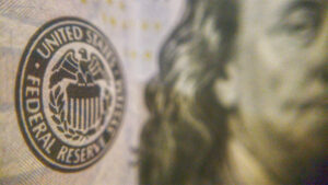 Seal of the federal reserve on a $100 bill