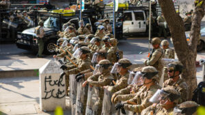 Photo of soldiers at the California 2025 ICE protests. Image by Wikimedia commons: https://upload.wikimedia.org/wikipedia/commons/f/f4/Los_Angeles_riots_-_June_2025_-_20250613.jpg