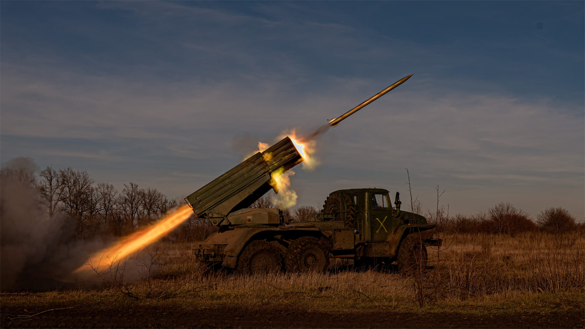 Military vehicle shooting artillery