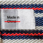 A made in China tag crossed out. Photo by Envato Elements and licensed