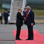 Putin and Trump shaking hands on the red carpet. Photo by Wikimedia Commons: http://www.kremlin.ru/events/president/news/77790/photos/82627