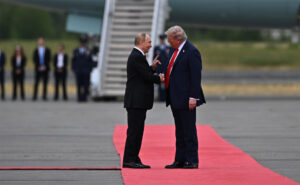 Putin and Trump shaking hands on the red carpet. Photo by Wikimedia Commons: http://www.kremlin.ru/events/president/news/77790/photos/82627