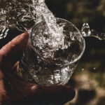 Water sloshing from a cup
