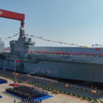 LHD Sichuan Class Aircraft Carrier | Photo by Wikimedia Commons: https://en.wikipedia.org/wiki/Type_076_landing_helicopter_dock#/media/File:LHD_Sichuan.jpg