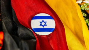 Israeli button on top of a German flag