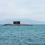 A submarine rising out of the water