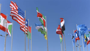 Flags of multiple countries blowing in the wind