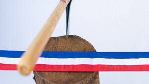 A French flag ribbon with an axe on a chopping block
