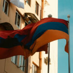 Flag of Armenia in front of an apartment complex