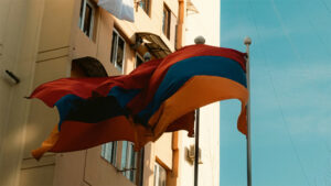 Flag of Armenia in front of an apartment complex
