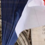 A french flag over the Arc de Triumph
