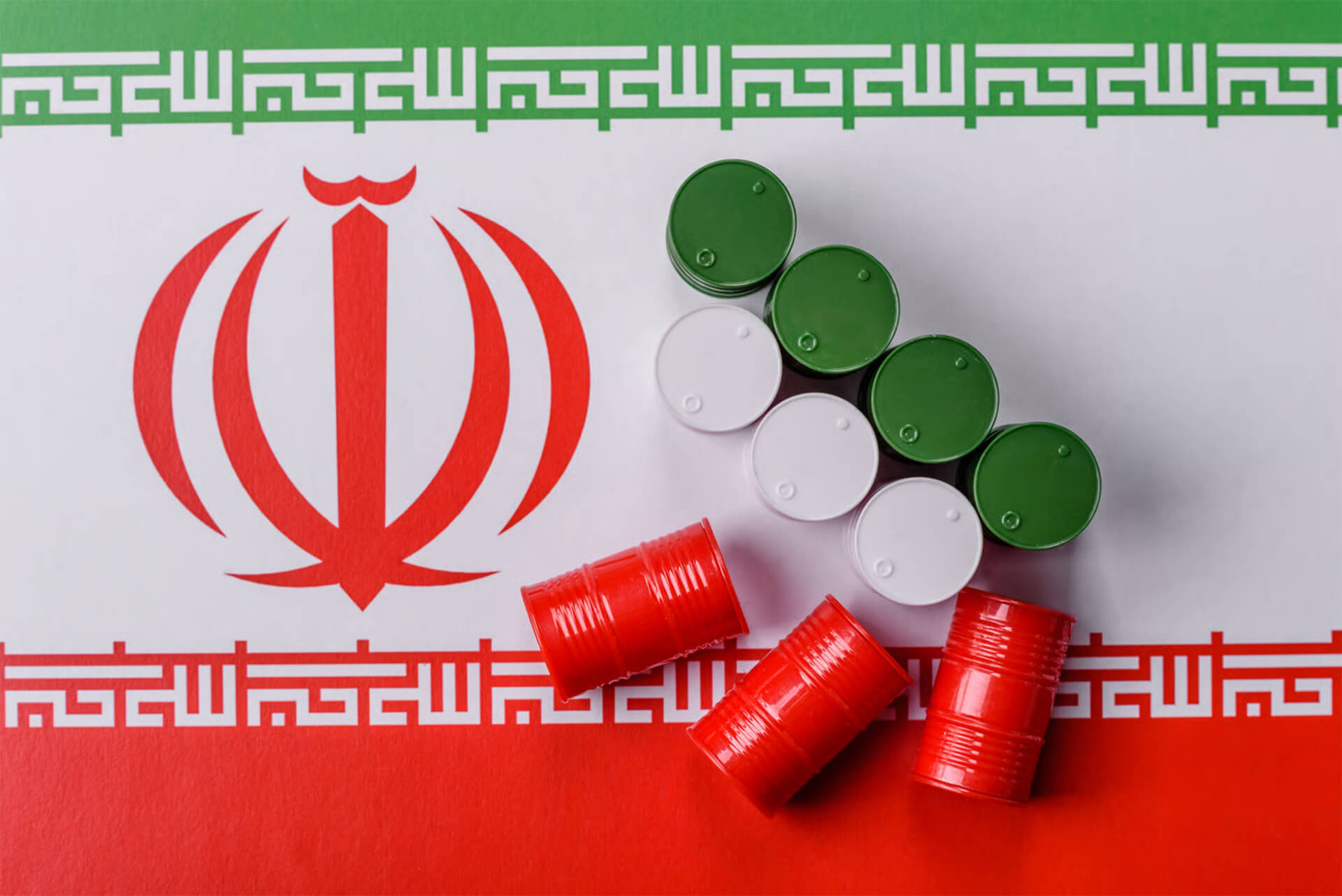 Iranian Flag with oil barrels the color of the flag in it | Licensed by Envato elements: https://app.envato.com/search/photos/0866085e-7b36-418f-9531-40faadc100cf?itemType=photos&term=Iran+oil