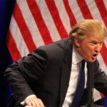 Donald Trump speaking at a podium and looking intense | Photo by Wikimedia Commons: https://upload.wikimedia.org/wikipedia/commons/9/90/Donald_Trump_speaking_at_CPAC_2011_by_Mark_Taylor.jpg