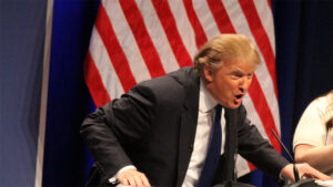 Donald Trump speaking at a podium and looking intense | Photo by Wikimedia Commons: https://upload.wikimedia.org/wikipedia/commons/9/90/Donald_Trump_speaking_at_CPAC_2011_by_Mark_Taylor.jpg