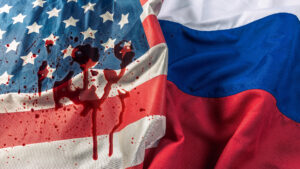 Photo of American flag with blood on it and Russian flag next to it