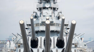 Navy warship with guns facing forward