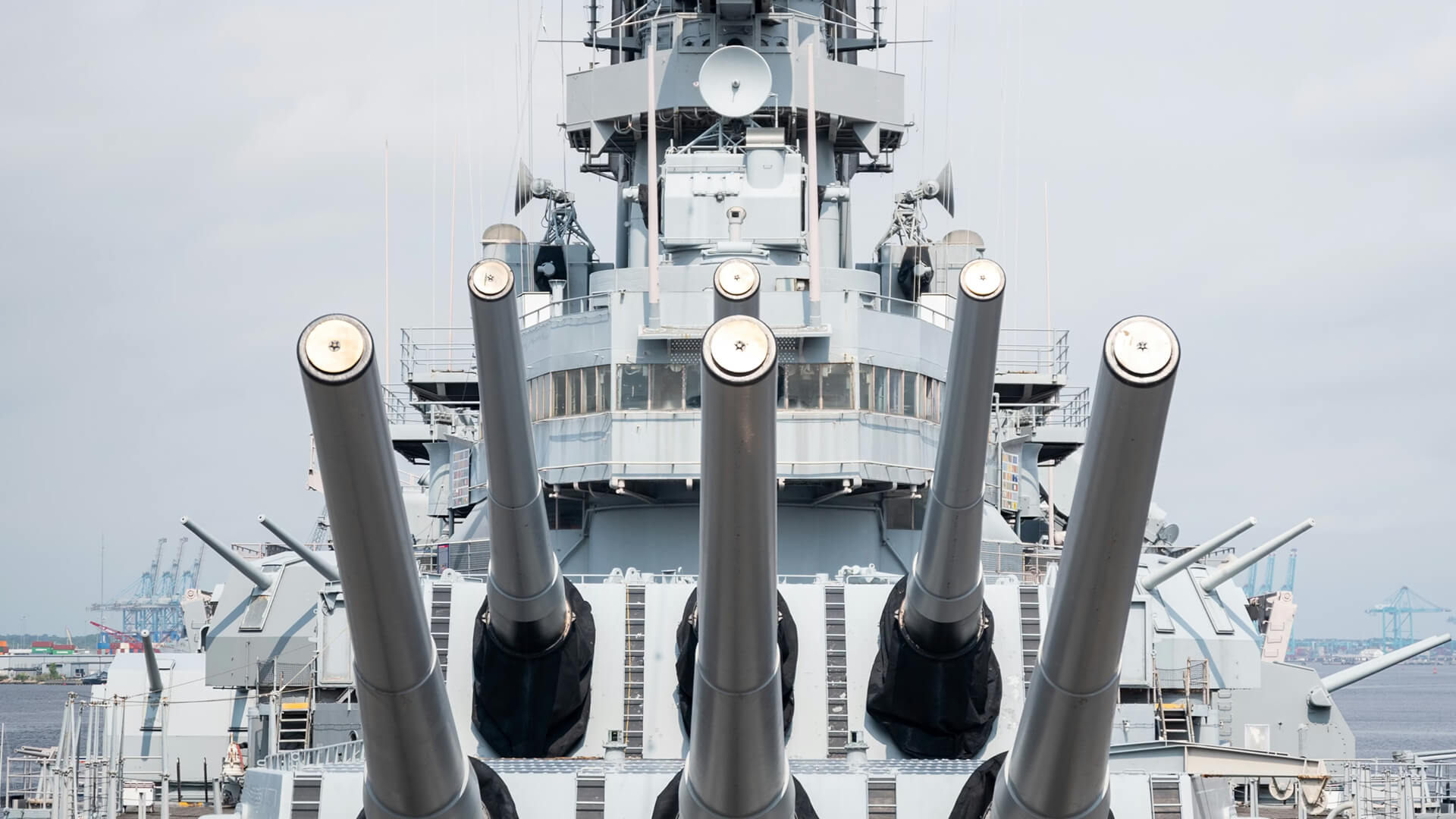 Navy warship with guns facing forward