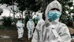 Doctors in biohazard suits