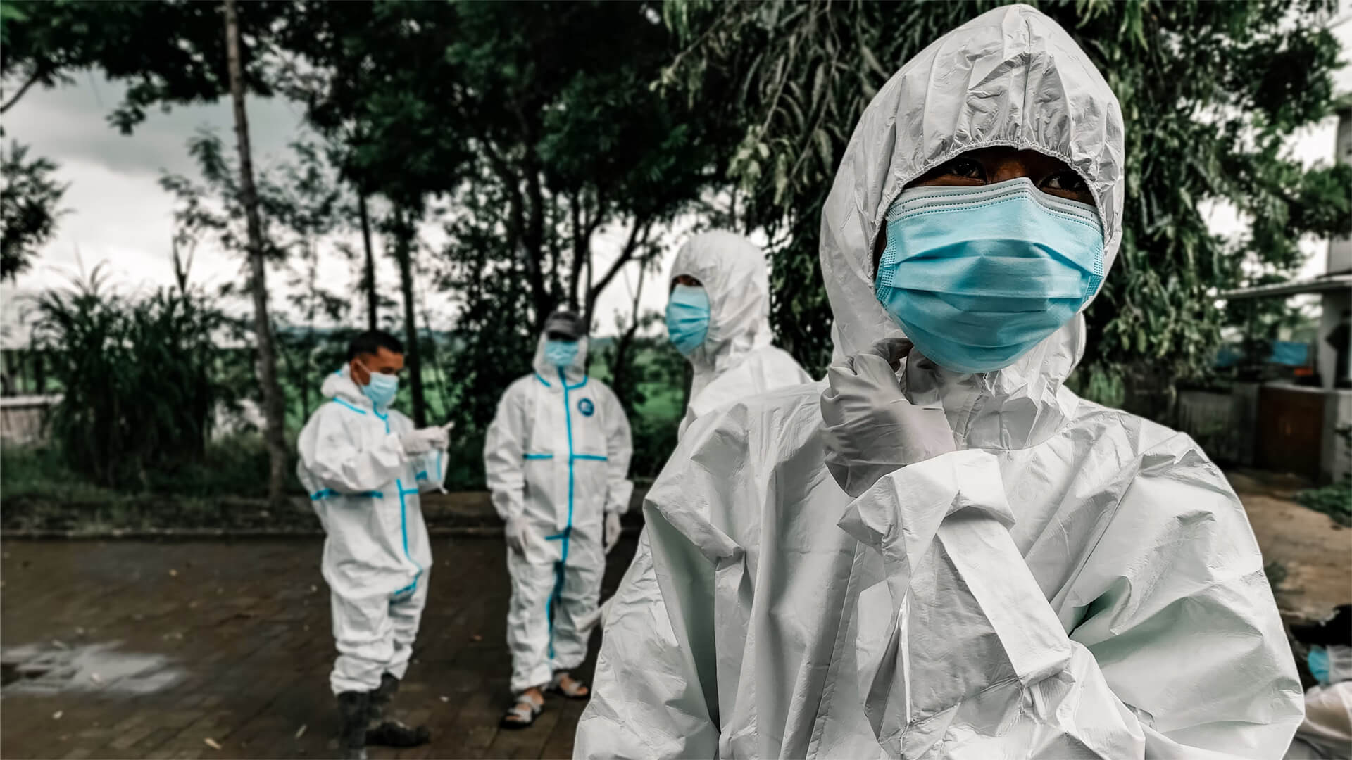 Doctors in biohazard suits