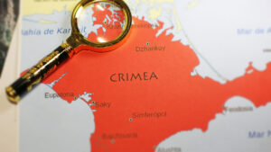 A magnifying glass on a map of Crimea | Licensed by Envato Elements