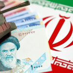 Toy Tank Atop Iranian Currency and Flag | Licensed by Envato Elements: https://app.envato.com/search/photos/3abc94ac-73db-4912-ae0d-3e507dd11191?itemType=photos&term=iran+war