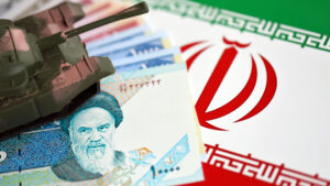 Toy Tank Atop Iranian Currency and Flag | Licensed by Envato Elements: https://app.envato.com/search/photos/3abc94ac-73db-4912-ae0d-3e507dd11191?itemType=photos&term=iran+war