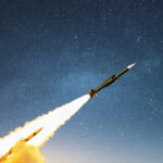 A cruise missile launching into a starry night sky | Licensed by Envato Elements
