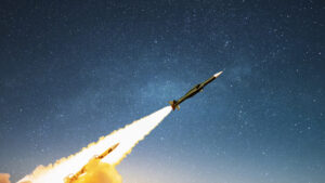 A cruise missile launching into a starry night sky | Licensed by Envato Elements