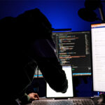 A hacker a a computer terminal