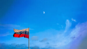 Russian flag at dusk with a moon in the background