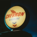 A chevron Gas sign against a dark night