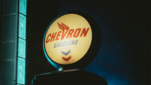 A chevron Gas sign against a dark night