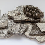 %) cobalt chips, electrolytically refined, as well as a high purity (99.8 % = 2N8) 1 cm3 cobalt cube for comparison | Photo by Wikimedia COmmons: https://en.wikipedia.org/wiki/Cobalt#/media/File:Kobalt_electrolytic_and_1cm3_cube.jpg