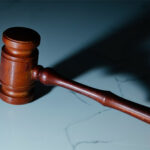 A court gavel on marble stone