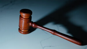 A court gavel on marble stone
