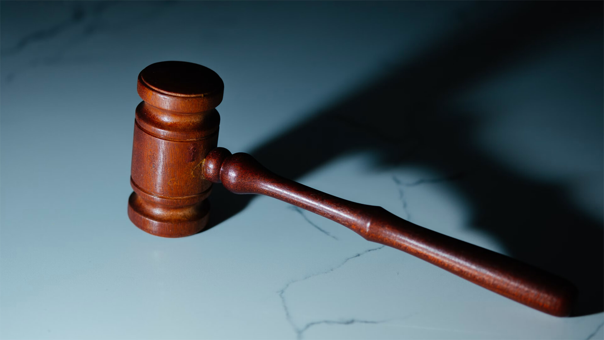 A court gavel on marble stone