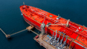 Large Red Tanker Ship Docks at an Oil Terminal