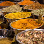 Various spices in metal bowls