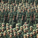 Chinese troops in formation and in camouflage fatigues